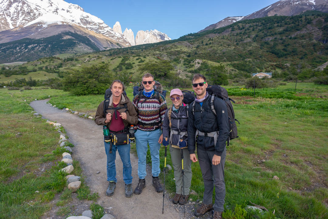 Four people standing at the start of the Torres del Paine trek