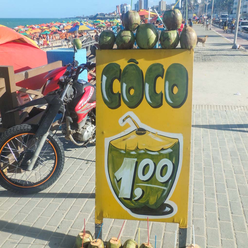A sign for R$1 coconuts at the beach in Natal, Brazil