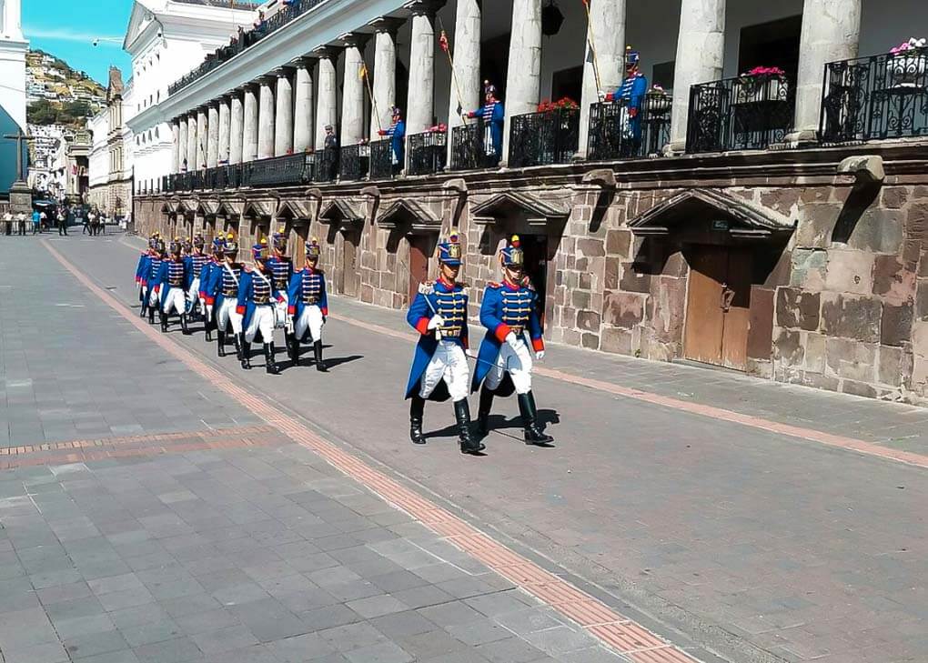 Guards march through the street during the changing of the guard in Quito, Ecuador