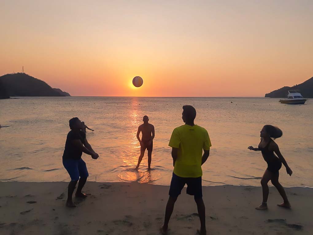People play beach volley ball in Taganga
