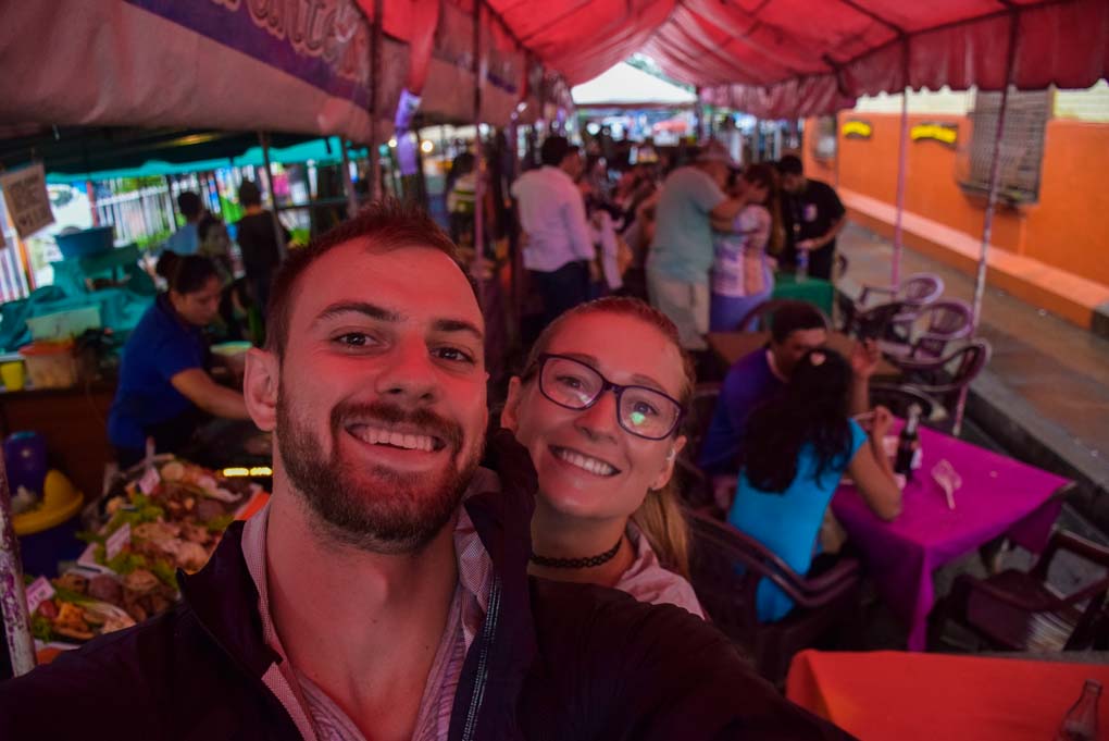 ailey adn Daniel take a selfie at the food festival in Juayua