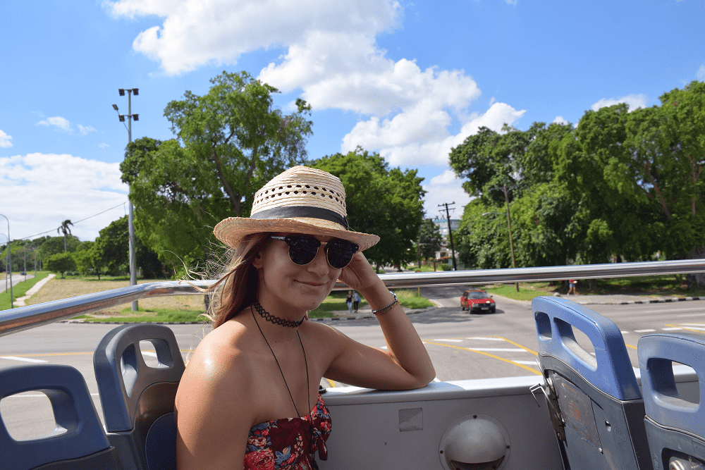 bailey riding in the hop on hop off bus in Havana, Cuba