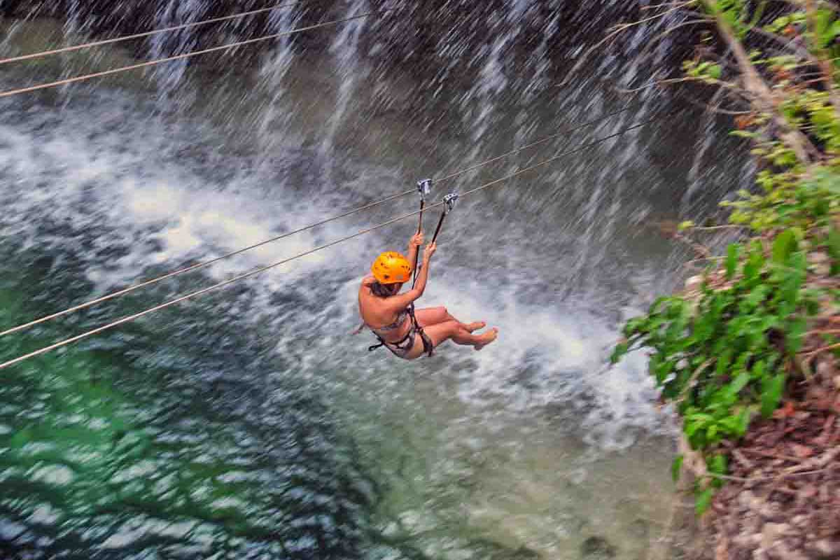Ziplining through Xplor Adventure Park Zip lining into waterfall