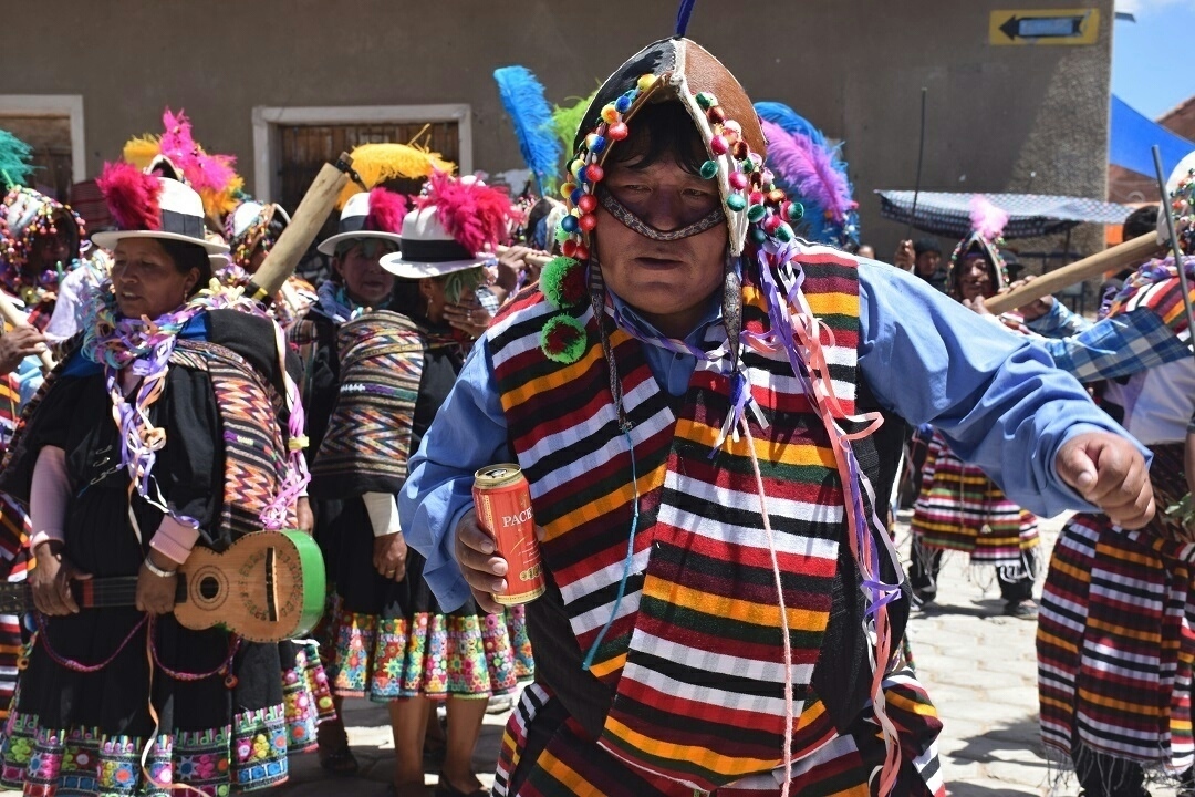 A man dances in traditional Bolivian clothing in Bolivia
