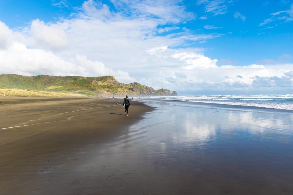 Walking along Bethells Beach New Zealand