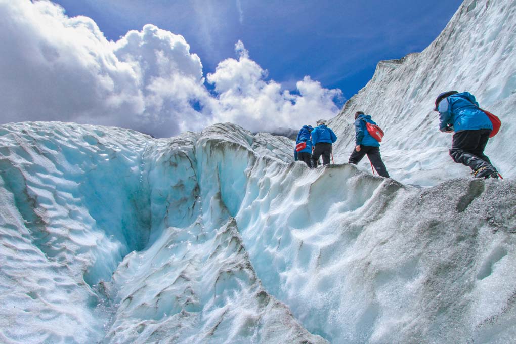 People hiking on the Franz Josef Glacier as part of a Franz Josef Glacier heli hike tour