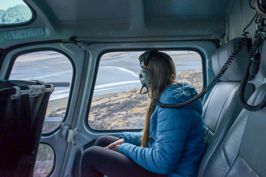 Bailey looking out the window on our scenic flight around Mount Cook
