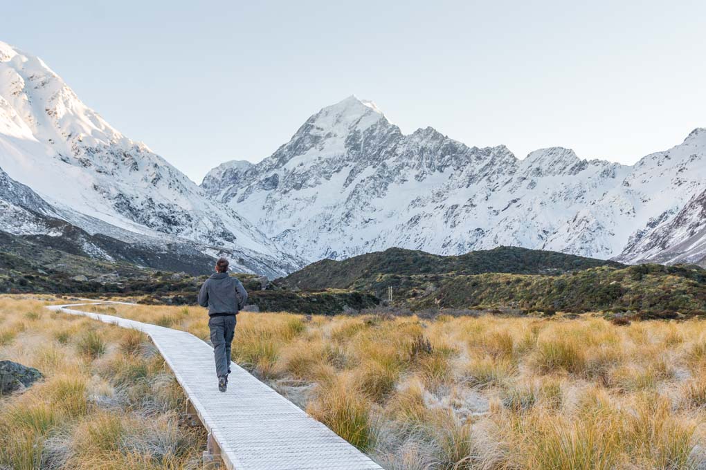 Daniel walking along the boardwalk of the Hooker Valley Track