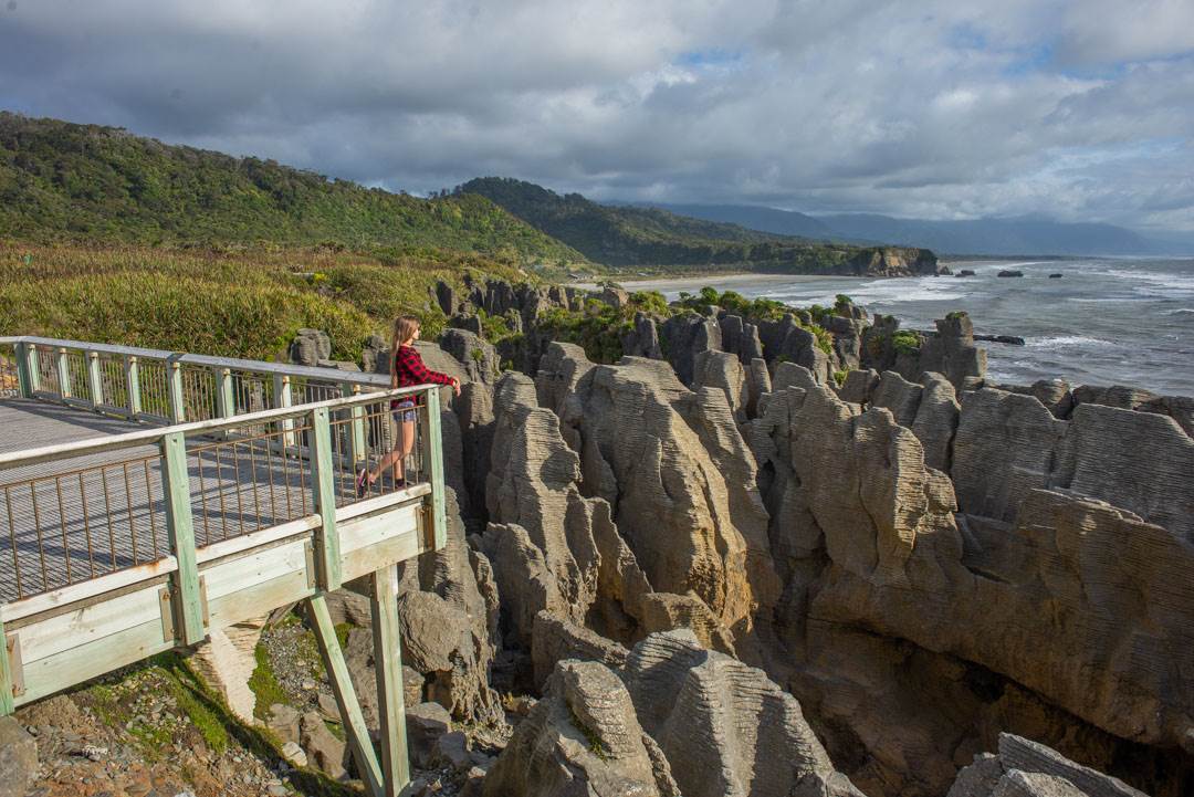 Bailey stands on the viewing platform at the Pancake Rocks, New Zealand