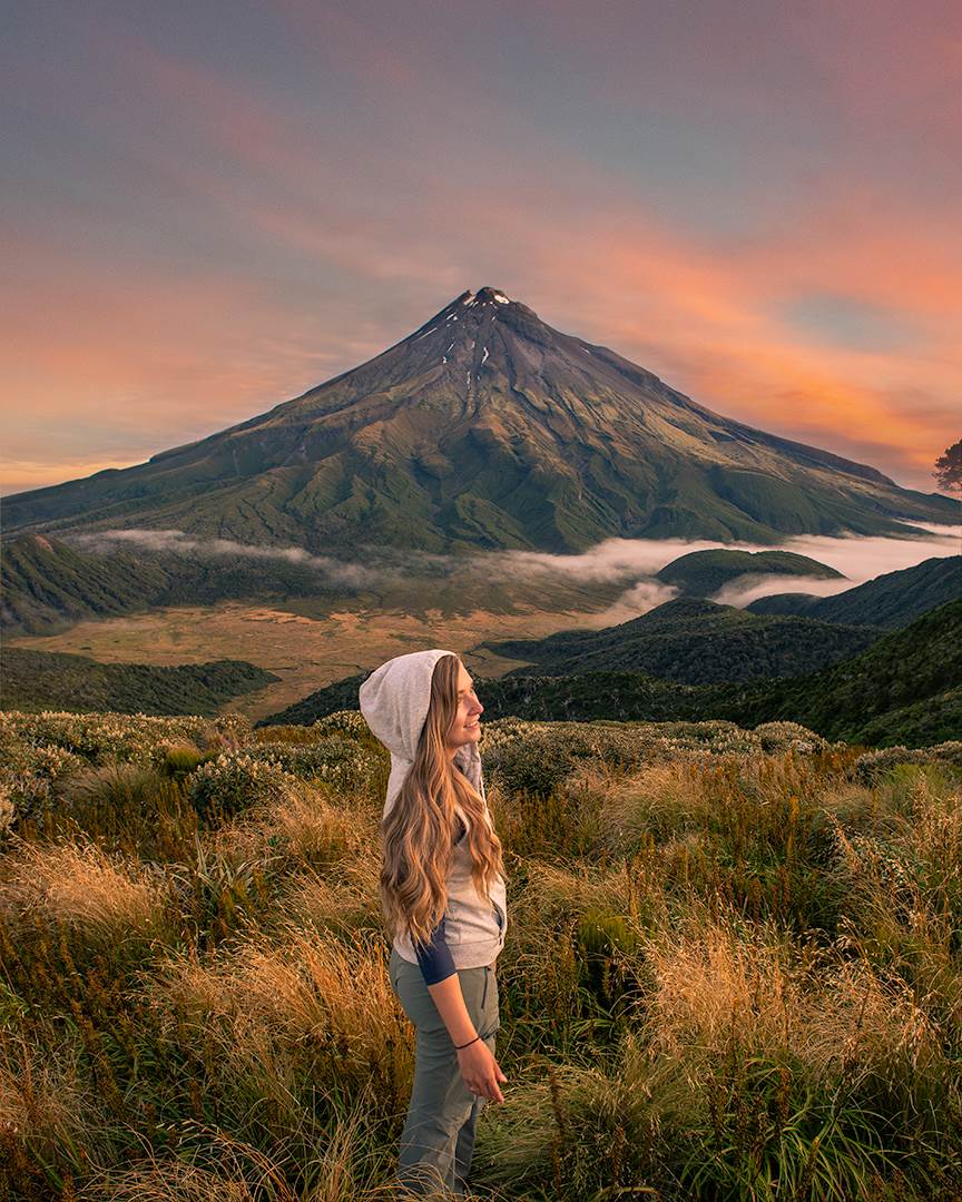 enjoying a sunset at the Pouakai Hut with views of Mount Taranaki