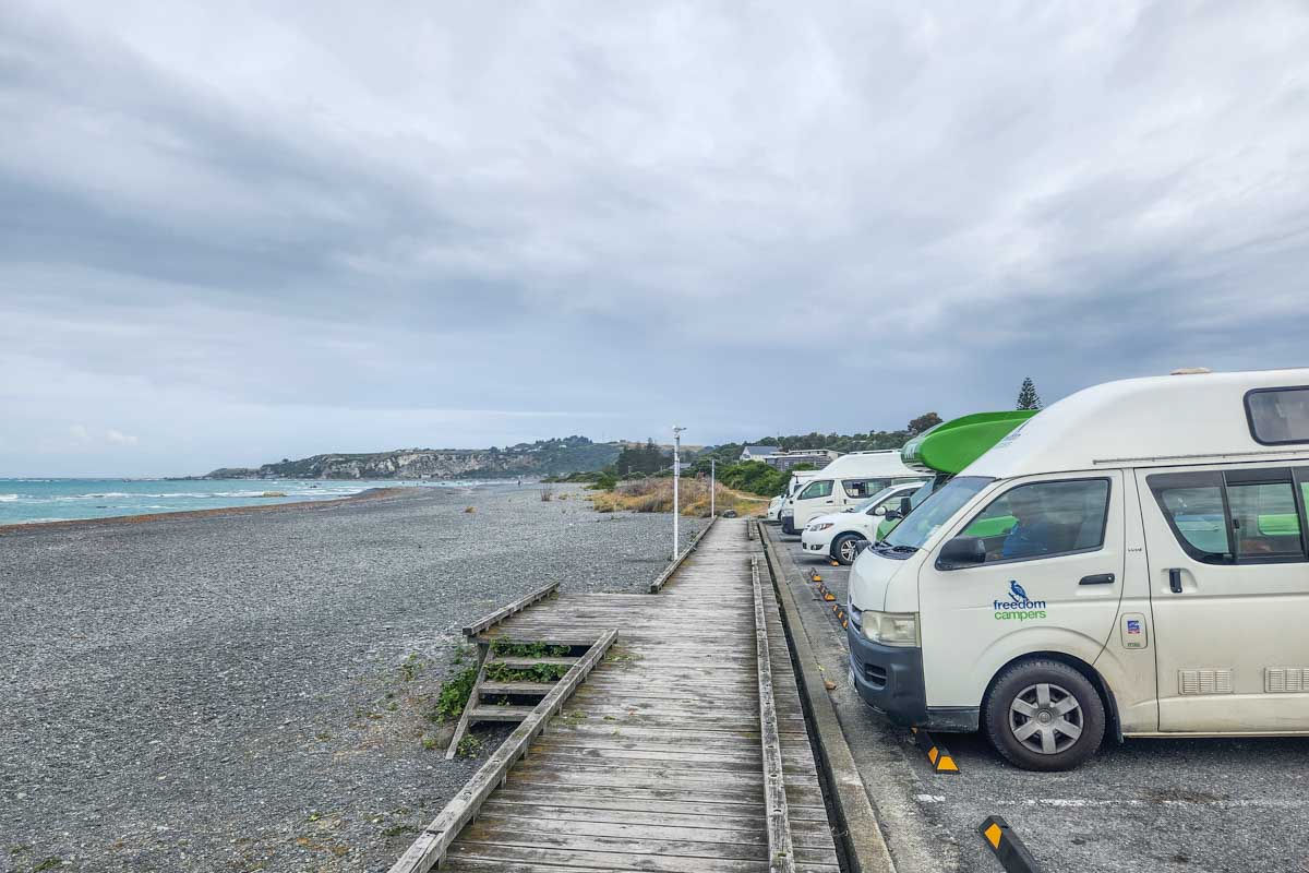 Campervans parked along the coats in Kaikoura, NZ
