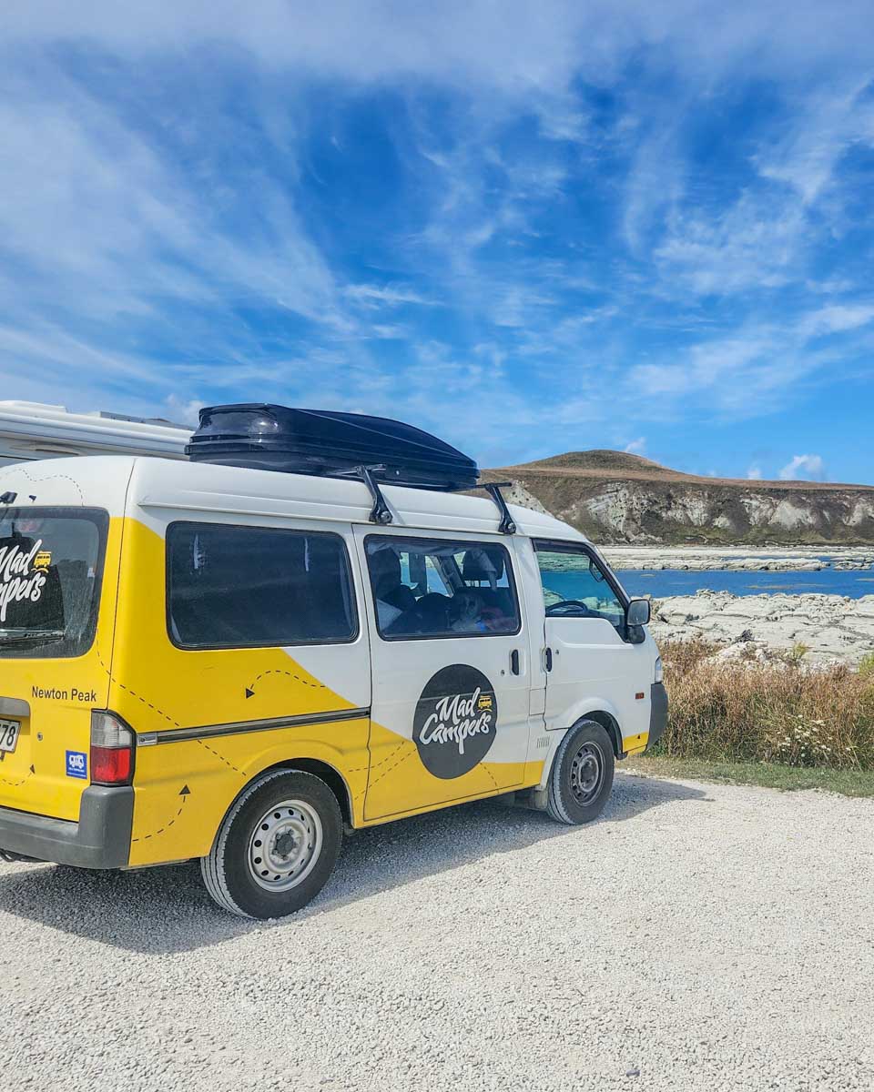 MAD Campers campervan parked up in kaikoura with views of the ocean
