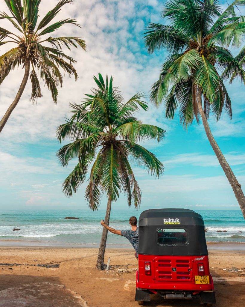 tuk tuk parked at the beach in mirissa sri lanka