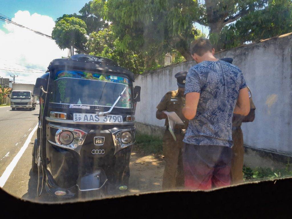 Getting pulled over by the Sri Lankan police in our tuk tuk