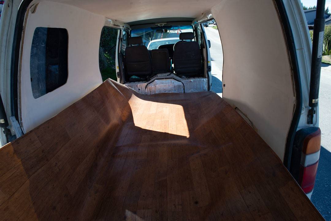 installing the flooring in our campervan conversion