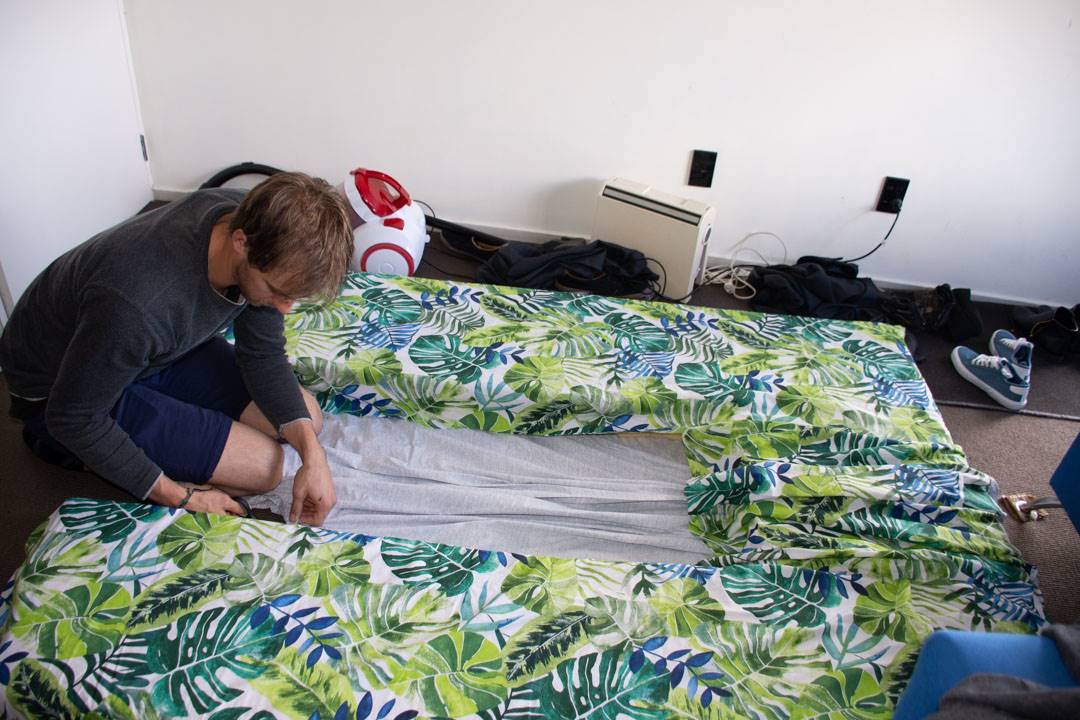 sewing up the mattress in our campervan conversion