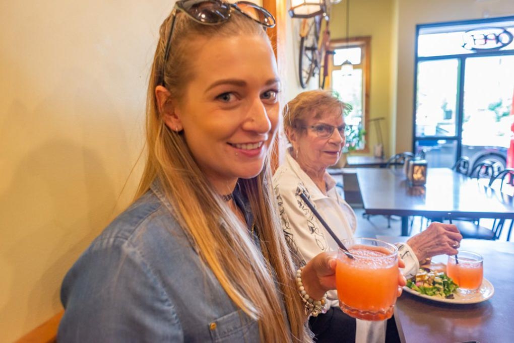 Bailey enjoys a drink on our Kelowna food tour in British Columbia