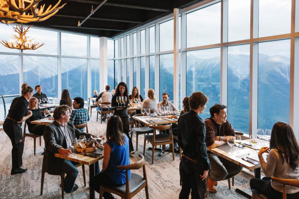 People eat at the Sky Bistro at the top of the Banff Gondola