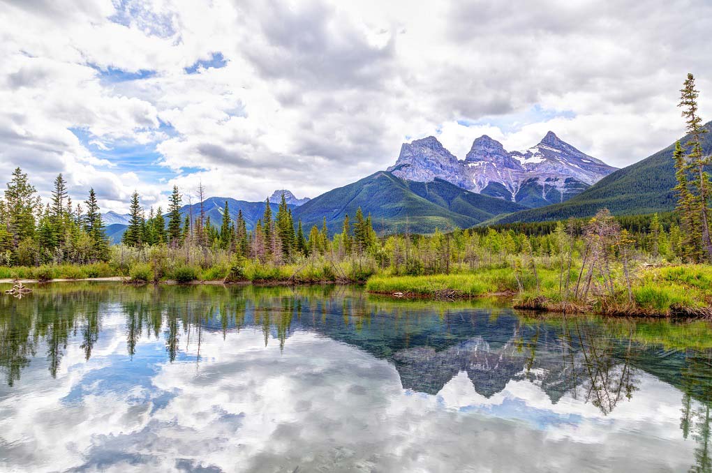 Three Sisters Mountain Peaks In The Canadian Rockies Of Canmore,
