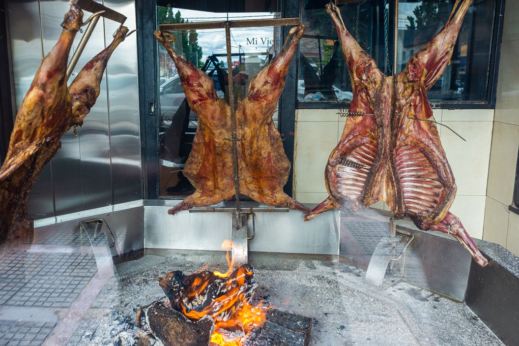 Patagonian Lamb roasting in the shopfront of a restaurant in Puerto Natales, Chile