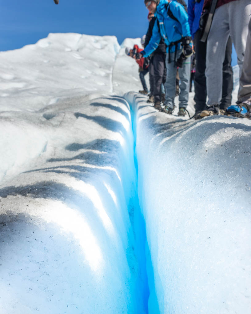 a deep blue crevasse on perito moreno glacier