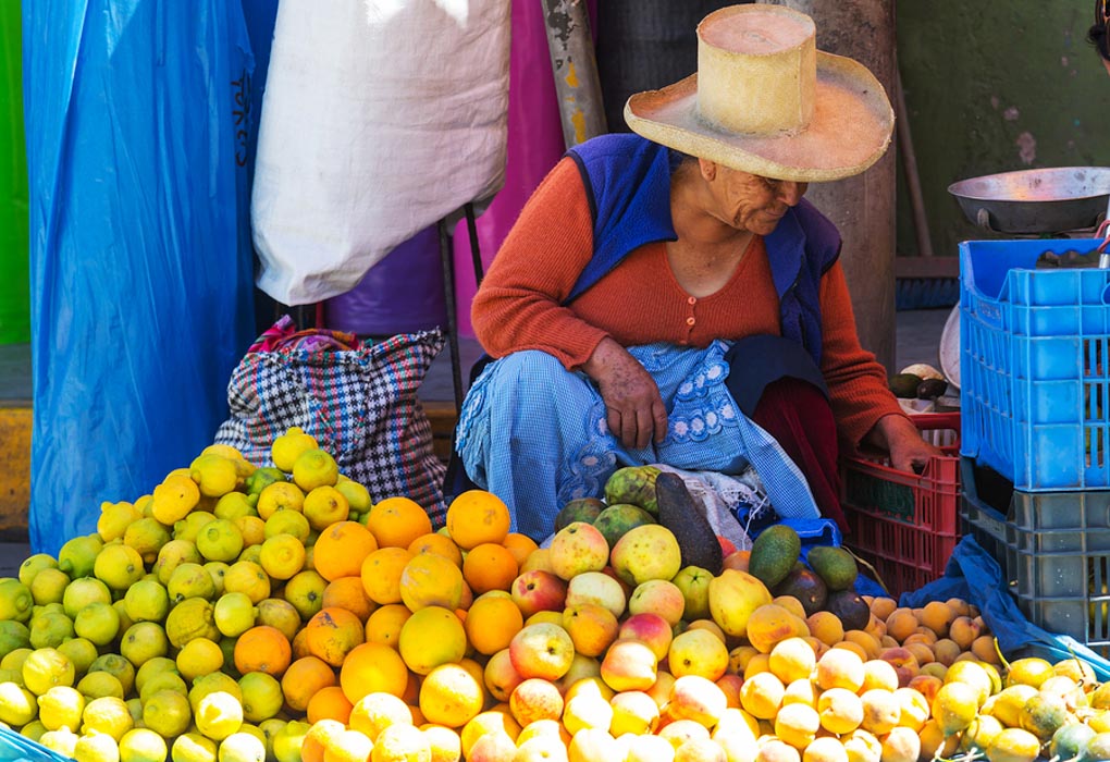 A lady selling fruit at the market in Huaraz, Peru - Photo Credit: Andrushko Galyna on Bigstock