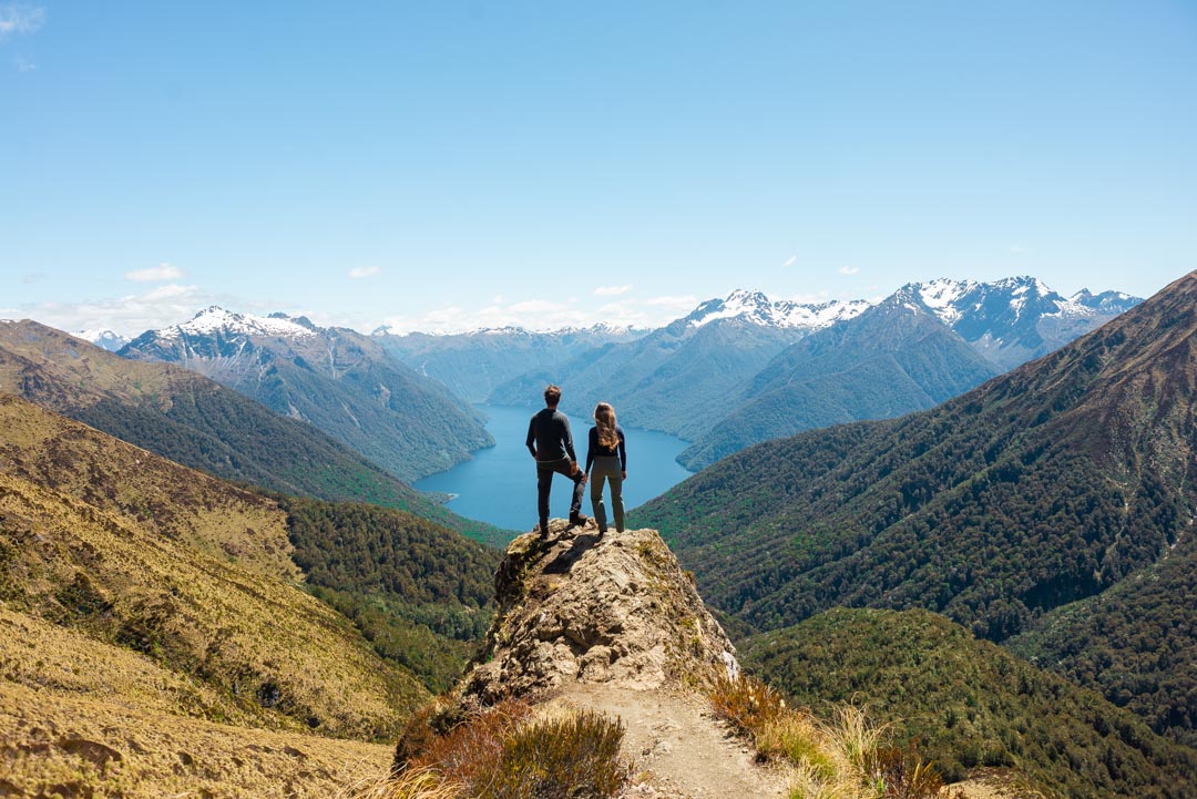 A couple stand on a viewpoint on the Kepler Track, New Zealand