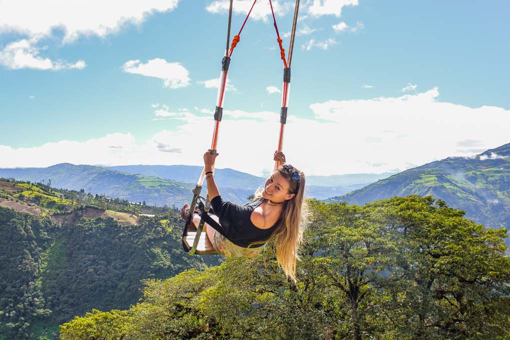 Bailey on the swing at the end of the earth in Banos, Ecuador