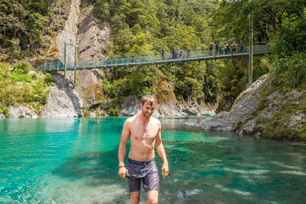 daniel walks our of the blue pools on new zealands west coast