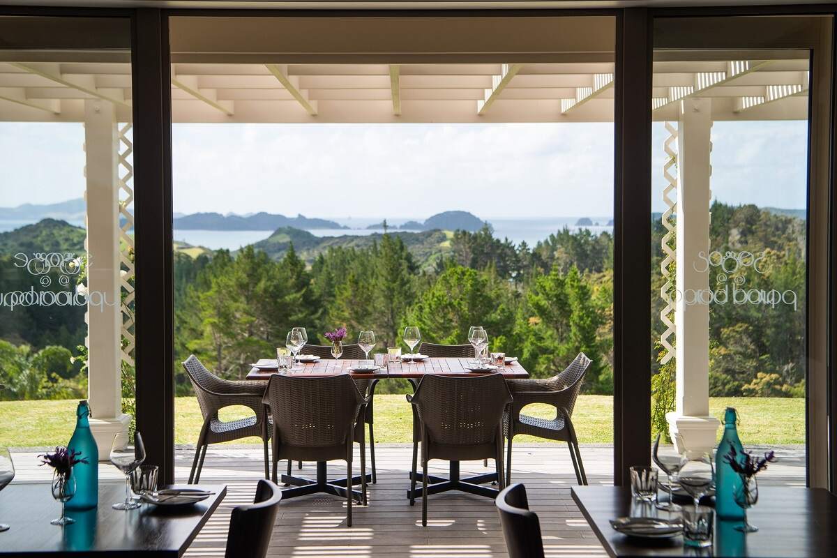 restaurant at Paroa Bay Winery with an ocean view