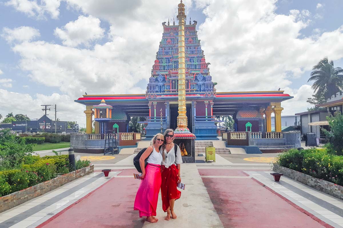 two women stand infront of Sri Siva Subramaniya Temple in Nadi, Fiji