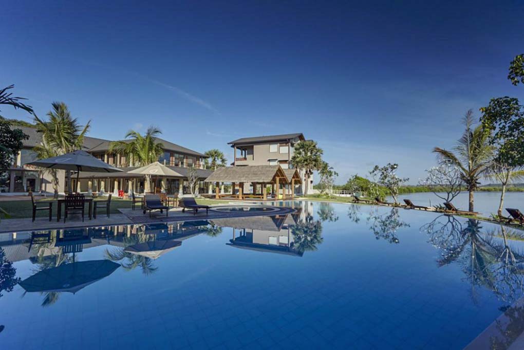 The pool and hotel at the Amaranthe Bay Resort and Spa