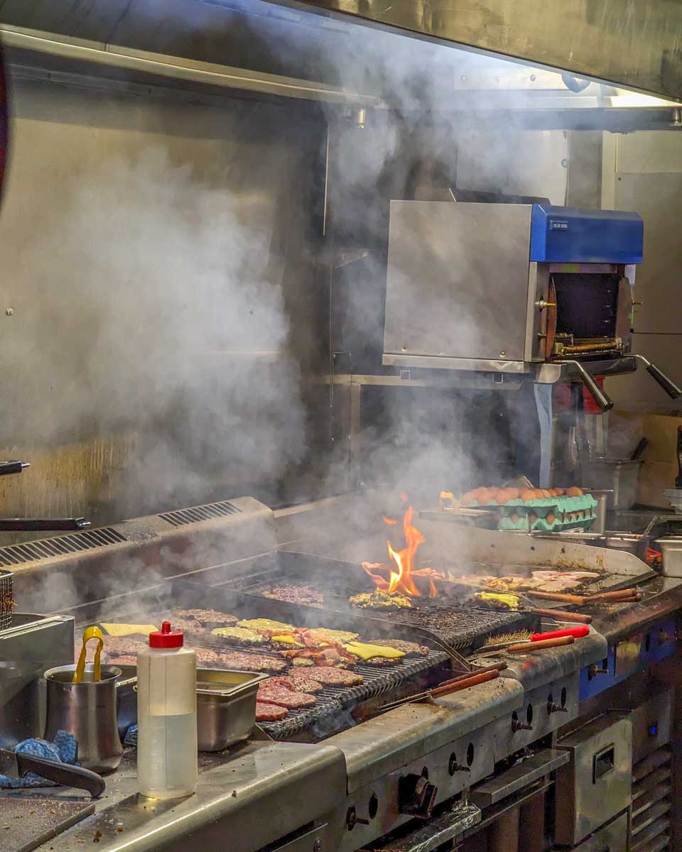 Burgers cooking at Ferg burger in Queenstown