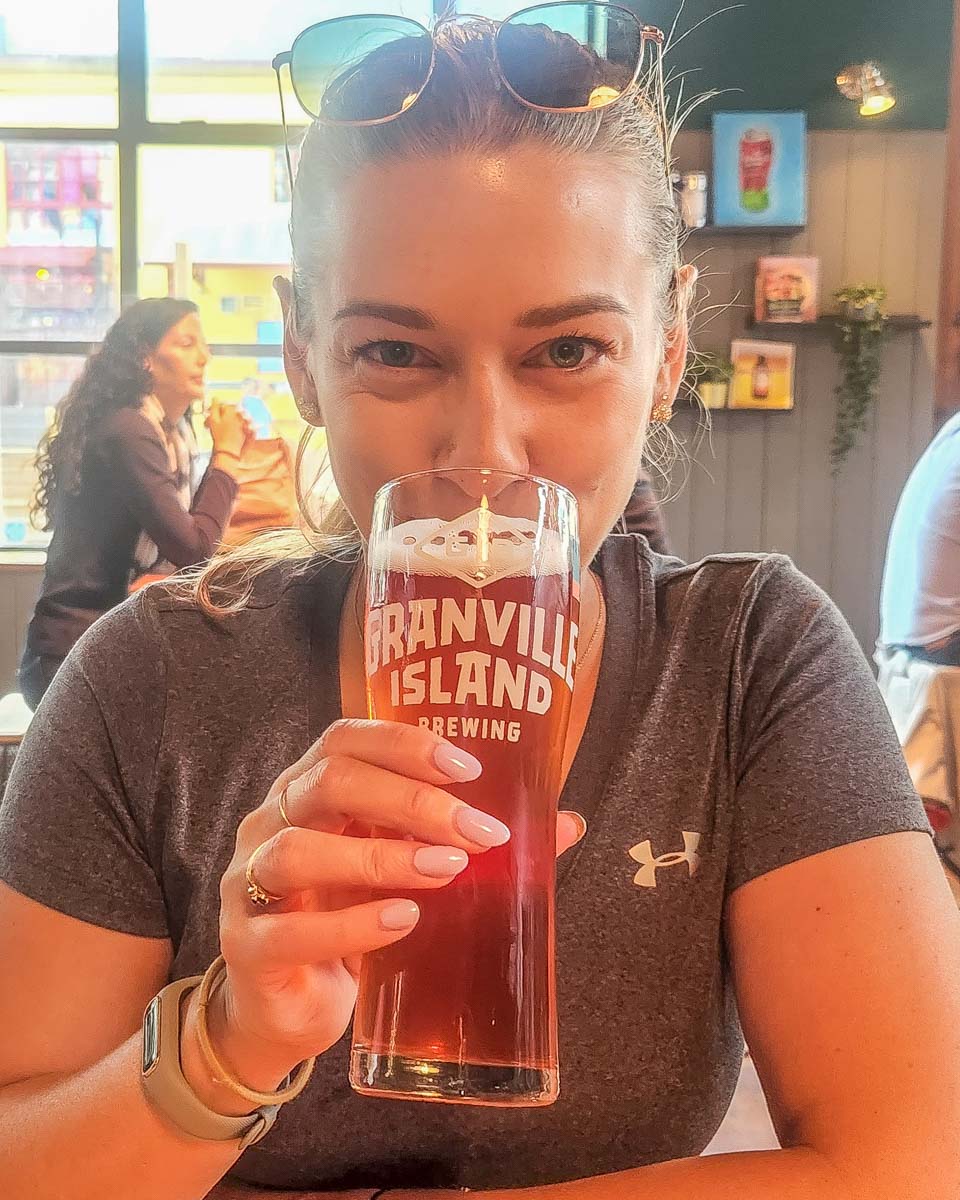 Bailey drinks a beer at Granville Island Brewing