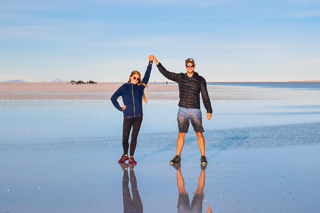 Bailey and Daniel pose for a photo on the salt flats in Bolivia