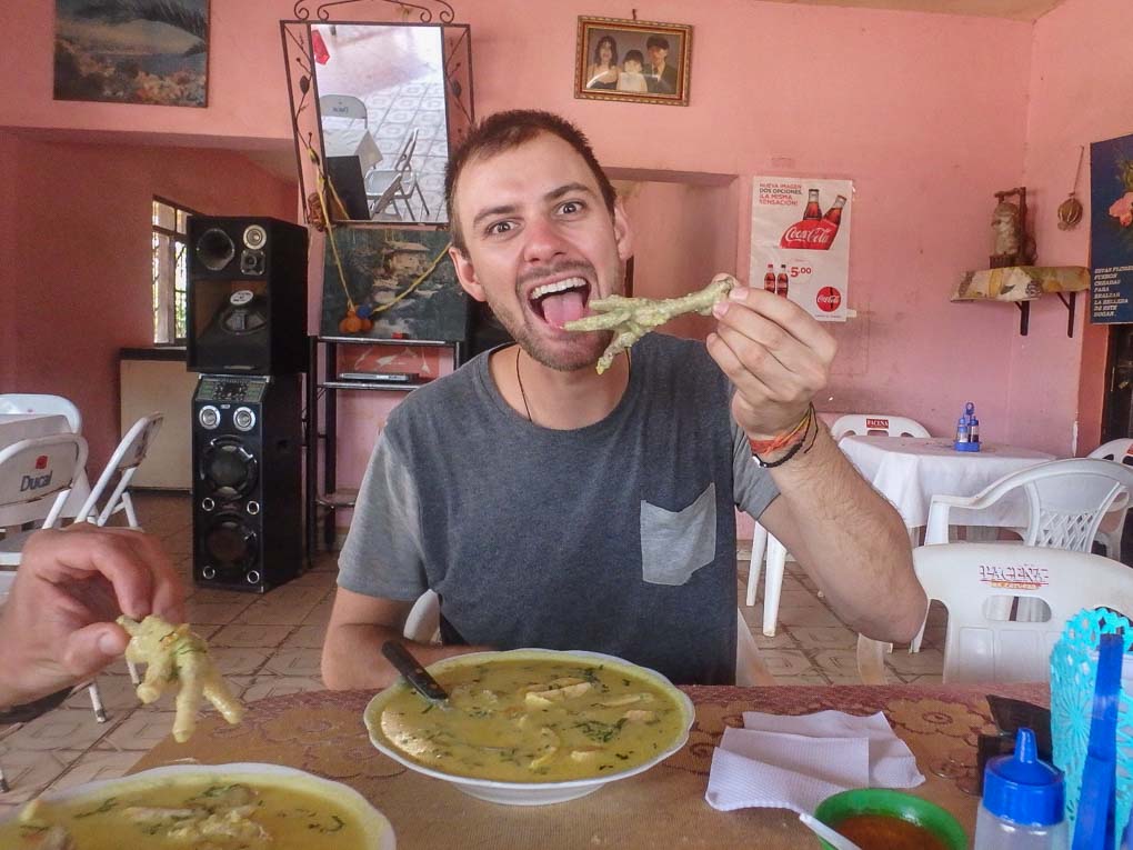 Daniel eats chicken foot soup in Samaipata, Bolivia