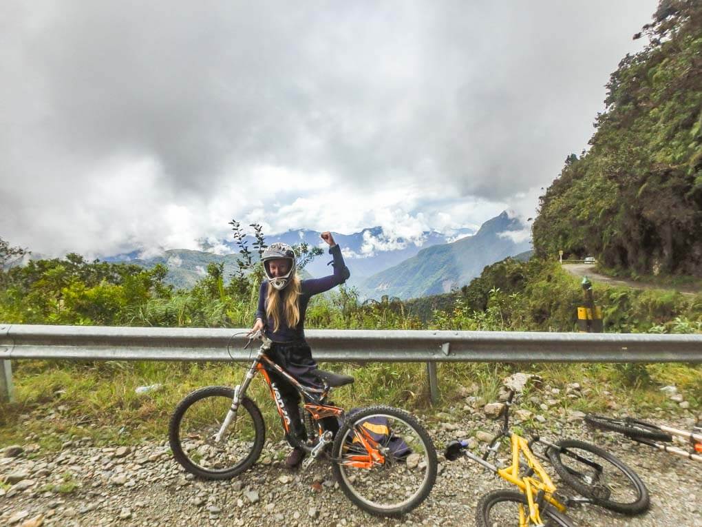 Bailey with her bike on the Death Road in Bolivia