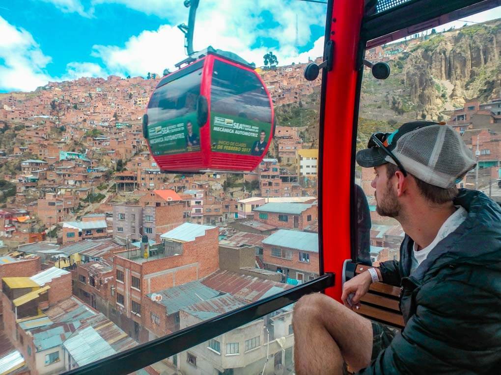 Daniel looks out the window of the gondola in La Paz, Bolivia