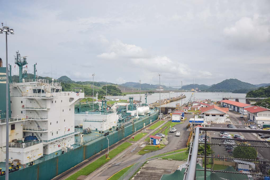 A ship leaves the narrow canals of the Panama Canal and enters the man made Gatun Lake