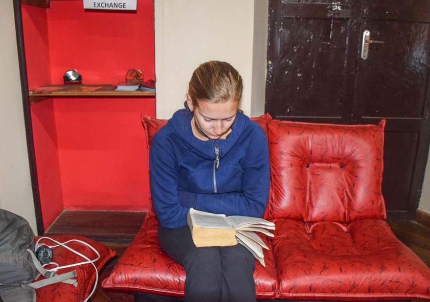 bailey studying spanish by reading a book in spanish