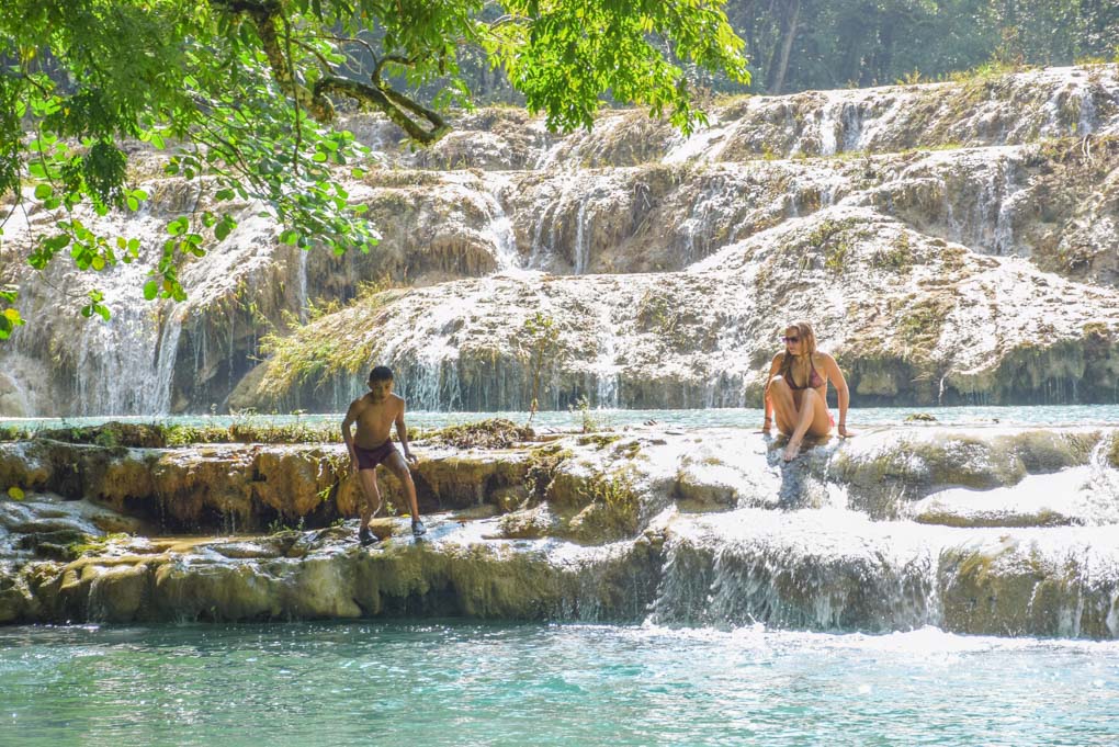 Local kids show Bailey where to jump into the water at Semuc Champey