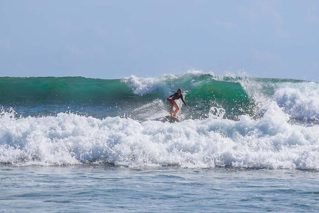 A lady surfs at Popoyo Beach