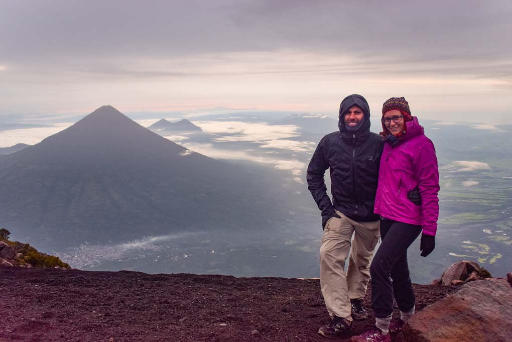 standing on the summit of Acatenango Volcano with Fuego Volcano in the background