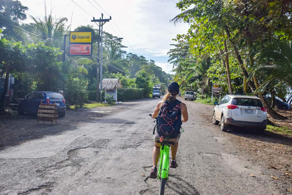 riding a bicyle in puerto viejo town in Costa Rica