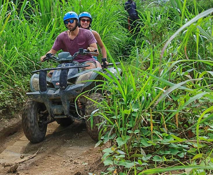 Daniel and Bailey riding an ATV