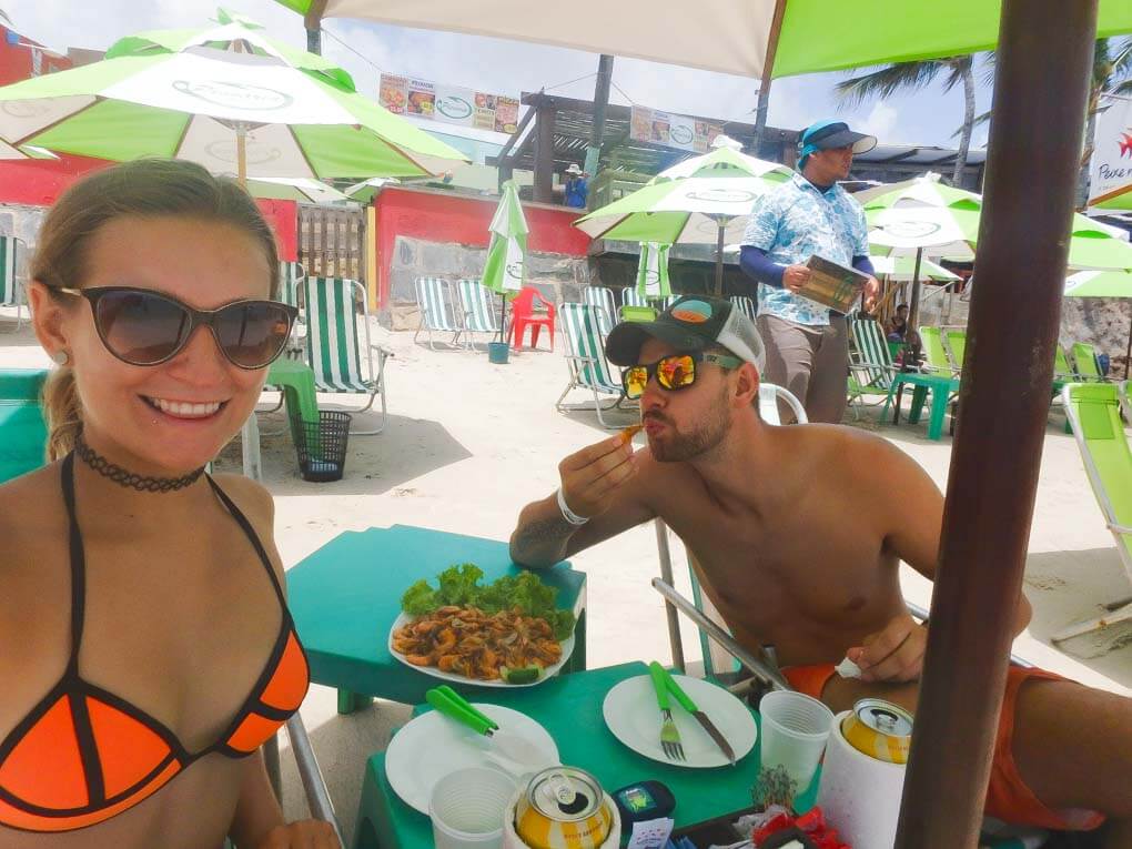 eating shrimp at Porta de Galinhas on a day trip from Recife, Brazil