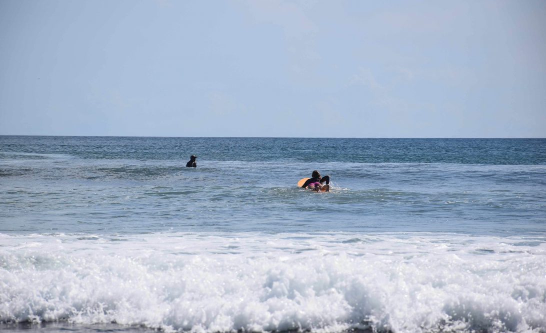 paddling on a surfboard in san juan del sur