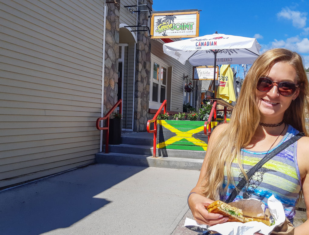 Bailey poses with her grilled cheese in front of the Spice joint, Jasper