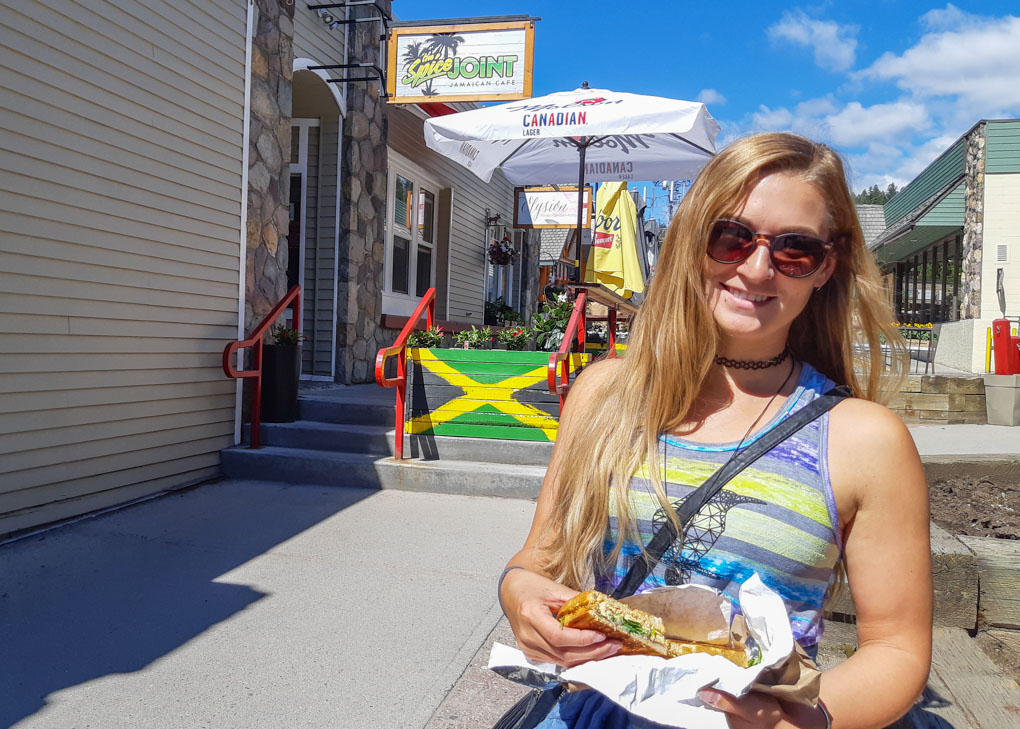 Bailey poses with her grilled cheese in front of the Spice joint, Jasper