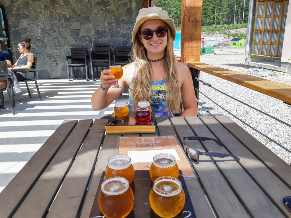 A lady drinks a bear at Folding Mountain Brewery and Taproom